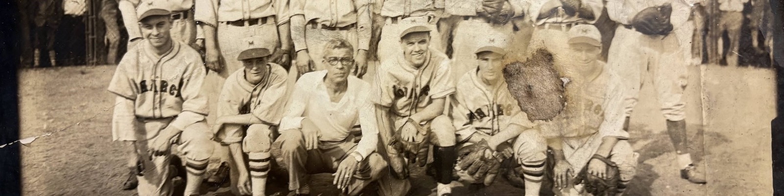 The Providence Monarchs baseball team; Arthur 'Daddy' Black kneels in the front row, third from left, in a white shirt and glasses